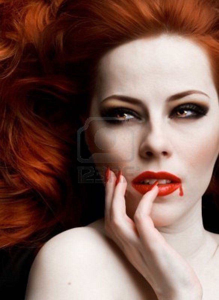 7003804-closeup-portrait-of-beautiful-redhead-vampire-woman.jpg